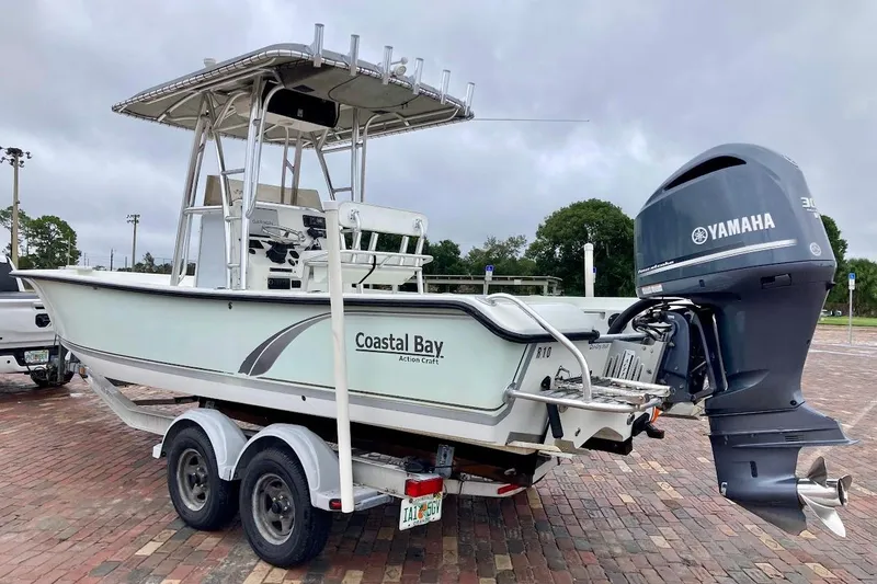 Slide: The Image of 2007 Action Craft Coastal Bay 2310 boat on trailer with Yamaha outboard motor. - 4