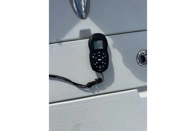 Slide: The Image of Remote control on Action Craft Coastal Bay 2310 boat, 2007 model. - 45