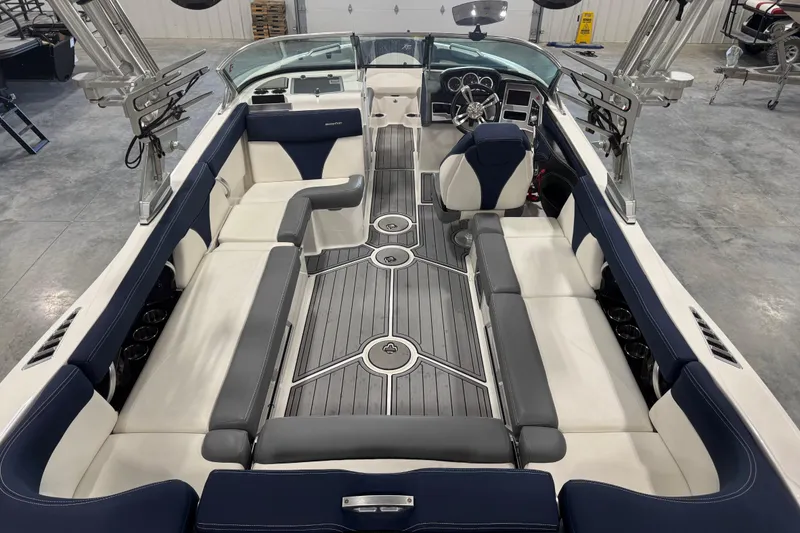 Slide: The Image of 2019 MasterCraft XT25 boat interior with spacious seating and modern design. - 6