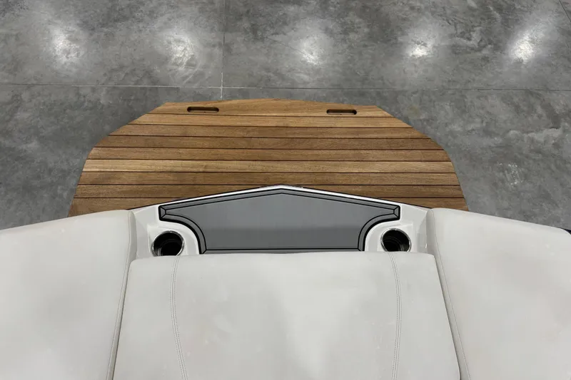 Slide: The Image of 2019 MasterCraft XT25 boat with teak swim platform and cushioned seating. - 7
