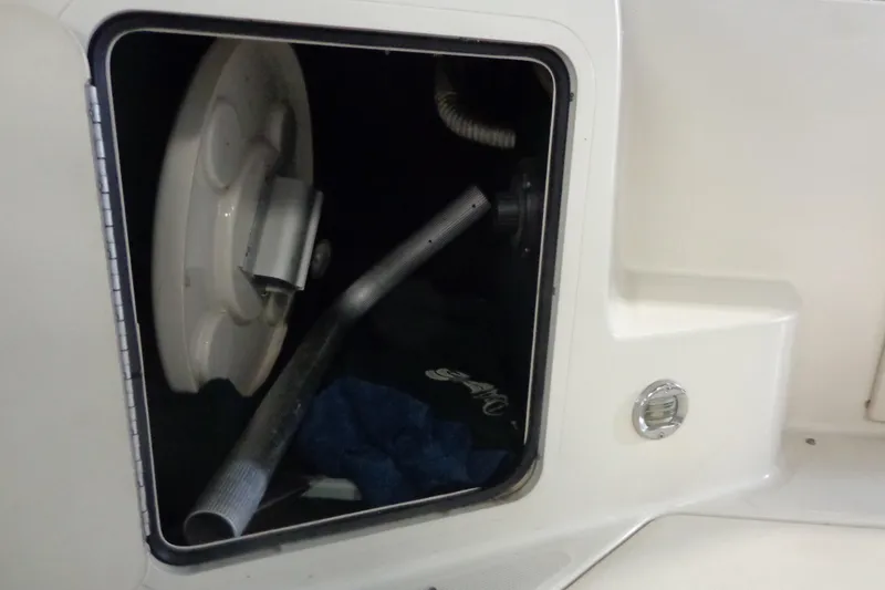 Slide: The Image of Storage compartment of a 2000 Sea Ray 240 Sundancer boat, showing interior details. - 29