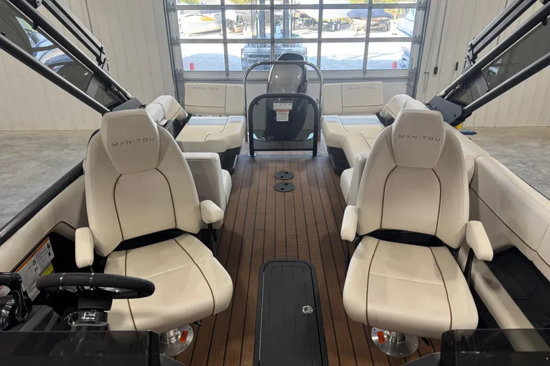 Slide: The Image of Interior of 2025 Manitou 26 Explore boat with luxurious seating and modern design. - 16