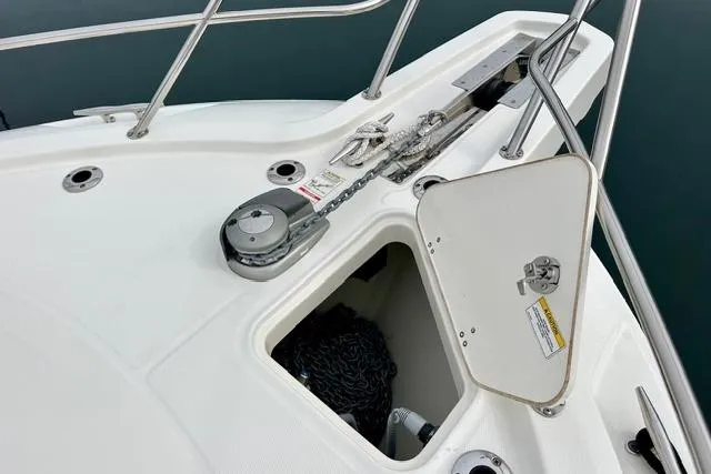 Slide: The Image of 2021 Boston Whaler 345 Conquest Pilothouse anchor storage and winch system. - 19