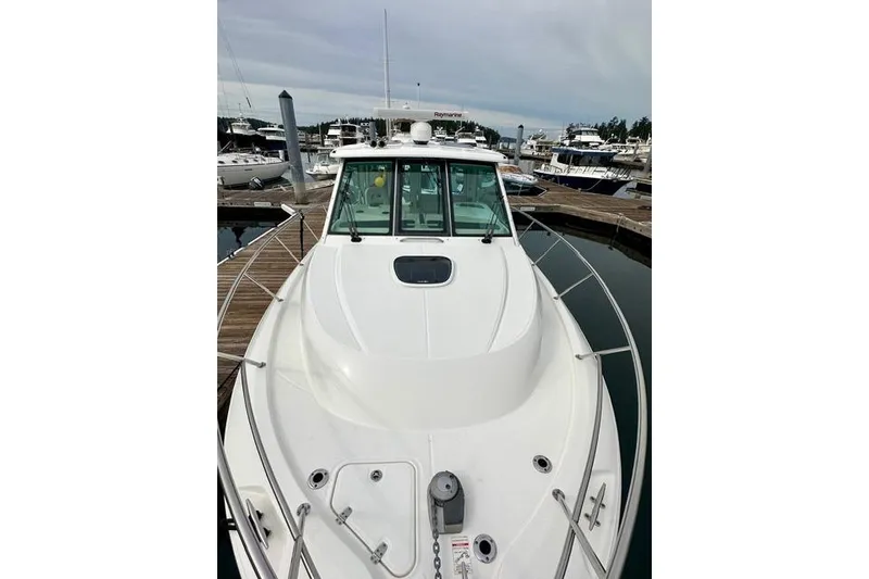 Slide: The Image of 2021 Boston Whaler 345 Conquest Pilothouse docked at marina, front view. - 20