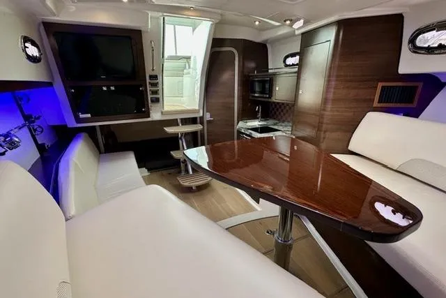 Slide: The Image of 2021 Boston Whaler 345 Conquest Pilothouse interior with elegant seating and modern amenities. - 23