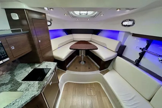 Slide: The Image of Interior of 2021 Boston Whaler 345 Conquest Pilothouse with modern seating and ambient lighting. - 24