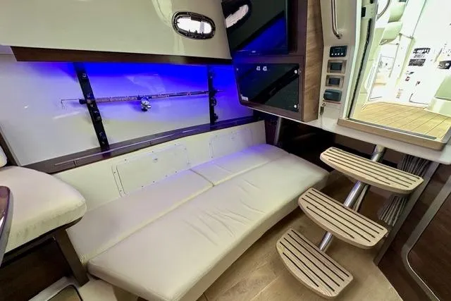 Slide: The Image of Interior of 2021 Boston Whaler 345 Conquest Pilothouse with seating and modern lighting. - 28