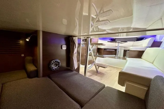 Slide: The Image of Interior of 2021 Boston Whaler 345 Conquest Pilothouse, featuring cozy seating and modern design. - 29