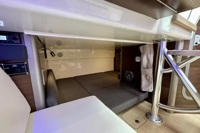 Slide: The Image of 2021 Boston Whaler 345 Conquest Pilothouse interior cabin with seating and storage. - 30