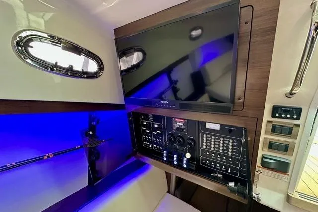 Slide: The Image of 2021 Boston Whaler 345 Conquest Pilothouse interior with control panel and screen. - 31