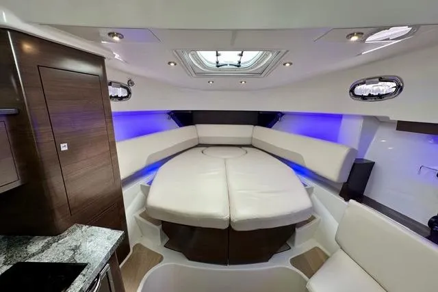 Slide: The Image of Luxurious interior of 2021 Boston Whaler 345 Conquest Pilothouse with plush seating and ambient lighting. - 32