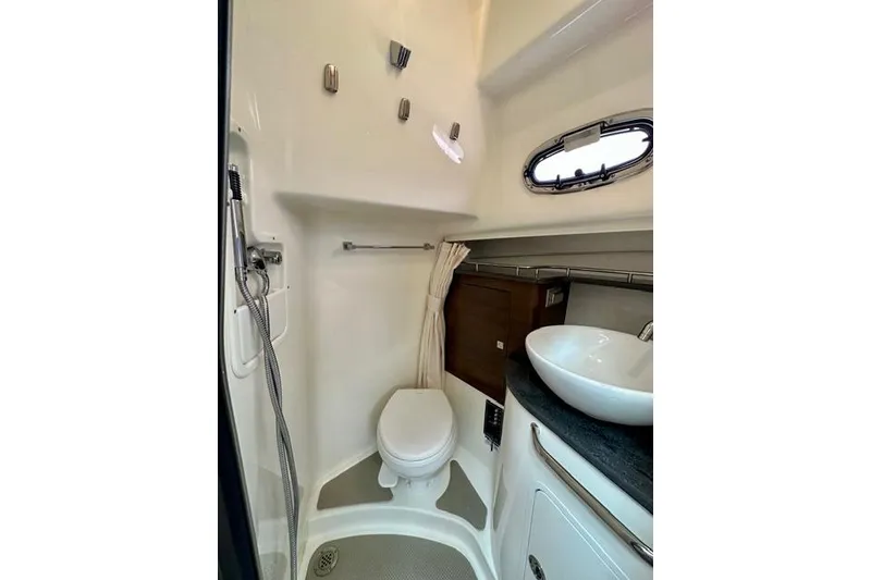 Slide: The Image of 2021 Boston Whaler 345 Conquest Pilothouse bathroom with toilet, sink, and shower. - 34
