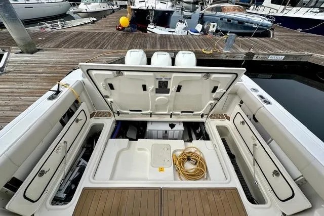 Slide: The Image of 2021 Boston Whaler 345 Conquest Pilothouse boat interior with open storage compartments. - 4