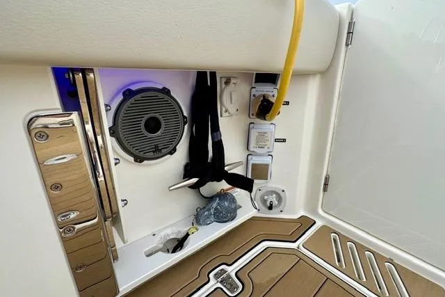 Slide: The Image of 2021 Boston Whaler 345 Conquest Pilothouse interior with speaker and utility panel. - 8