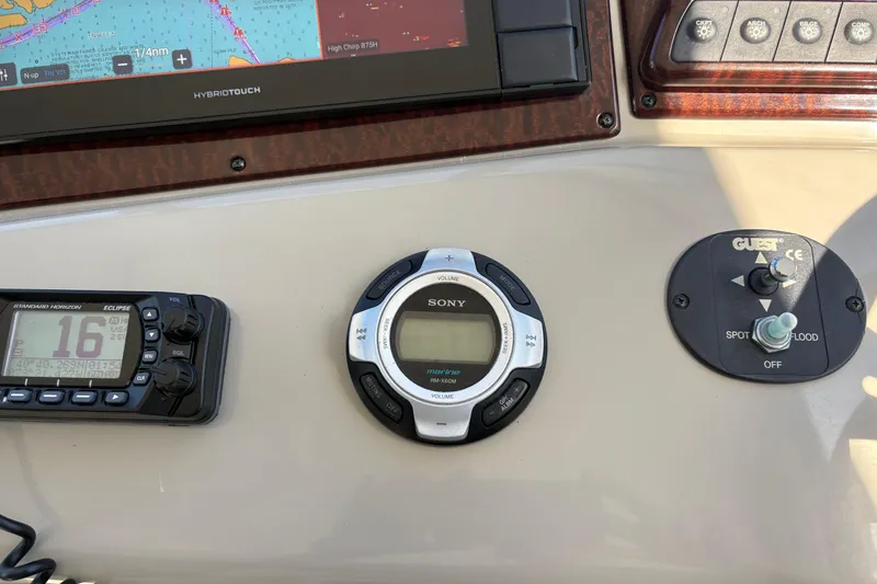 Slide: The Image of 2012 Sea Ray 370 Sundancer boat seating with beige and white upholstery. - 10