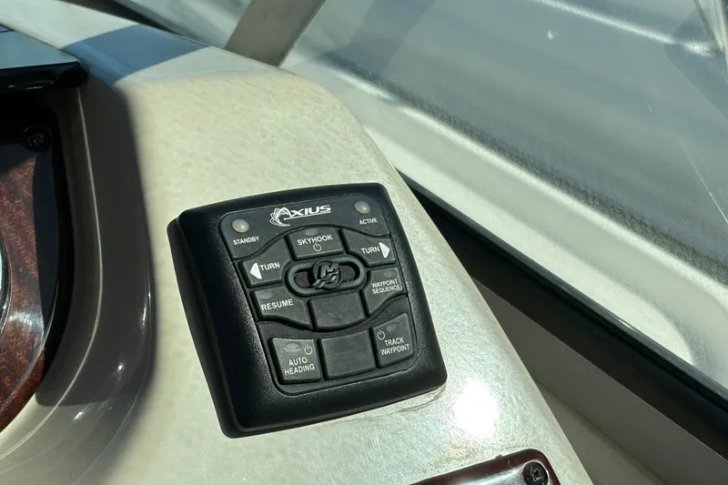 Slide: The Image of Control panel of a 2012 Sea Ray 370 Sundancer with marine radio and audio system. - 11