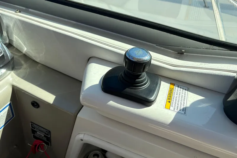 Slide: The Image of Control panel on a 2012 Sea Ray 370 Sundancer boat for spotlight and floodlight settings. - 14