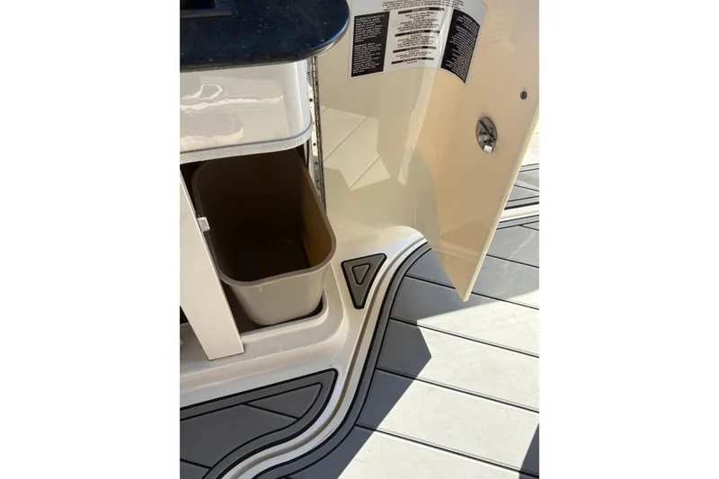 Slide: The Image of Open refrigerator on 2012 Sea Ray 370 Sundancer yacht, showcasing sleek interior design. - 19