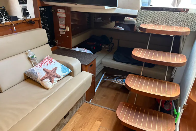 Slide: The Image of Built-in Kenyon grill on 2012 Sea Ray 370 Sundancer yacht, featuring sleek countertop design. - 25