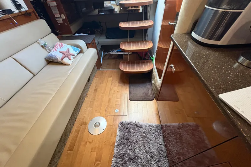 Slide: The Image of Interior view of 2012 Sea Ray 370 Sundancer yacht with cup holders and railing. - 26