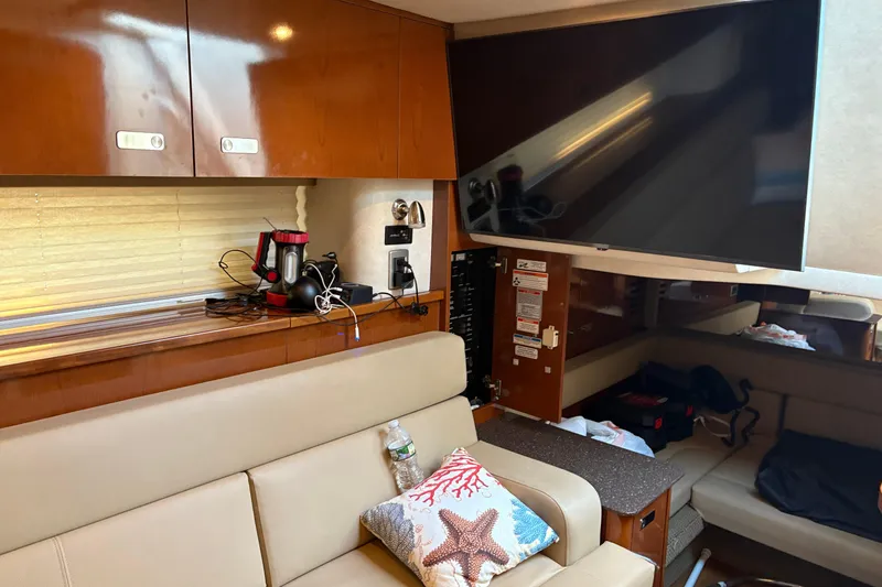 Slide: The Image of 2012 Sea Ray 370 Sundancer boat with radar equipment on deck, docked at marina. - 28