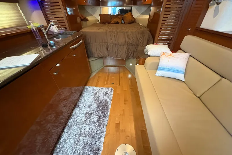 Slide: The Image of 2012 Sea Ray 370 Sundancer yacht deck with sleek design and stainless steel railings. - 29