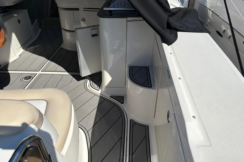Slide: The Image of Sea Ray 370 Sundancer 2012 docked beside another boat in a marina. - 3