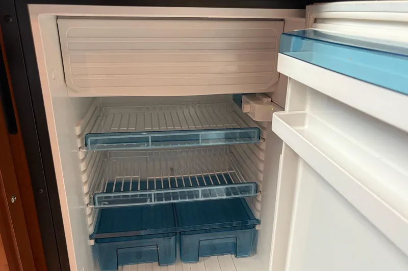 Slide: The Image of 2012 Sea Ray 370 Sundancer yacht deck with stainless steel railings and cup holders. - 32