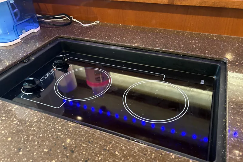 Slide: The Image of 2012 Sea Ray 370 Sundancer boats docked side by side, showcasing sleek design and railings. - 33