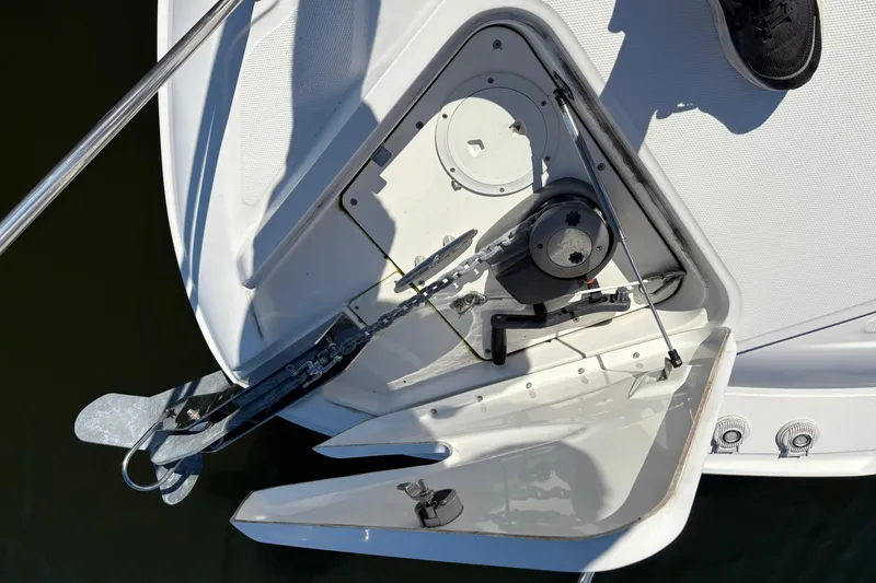 Slide: The Image of Luxurious interior cabin of 2012 Sea Ray 370 Sundancer with cozy bedding and wooden finishes. - 42