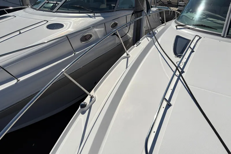 Slide: The Image of Luxurious interior of 2012 Sea Ray 370 Sundancer yacht with cozy bed and kitchenette. - 43