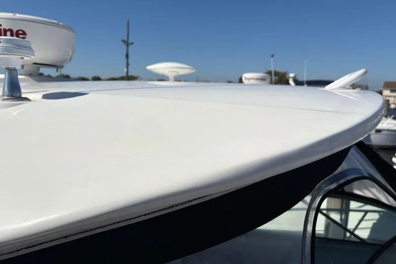 Slide: The Image of Empty refrigerator inside 2012 Sea Ray 370 Sundancer boat, featuring blue-tinted shelves. - 46