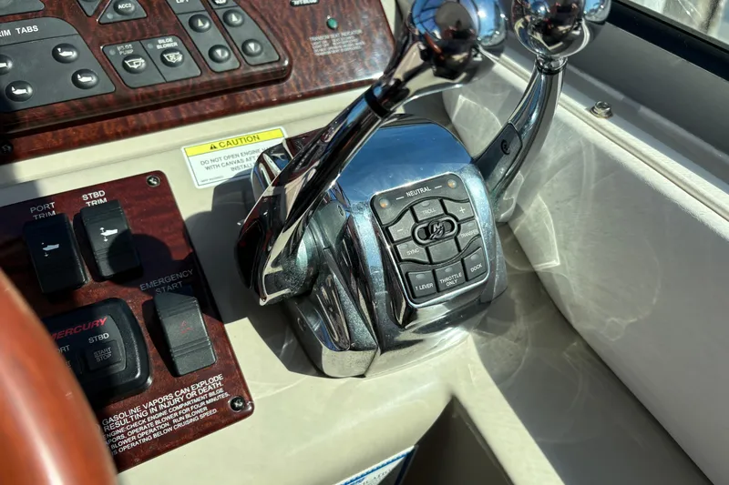 Slide: The Image of Cockpit of 2012 Sea Ray 370 Sundancer with gauges, controls, and steering wheel. - 6