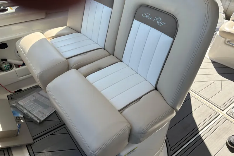 Slide: The Image of Control panel of a 2012 Sea Ray 370 Sundancer boat, featuring throttle and switches. - 8