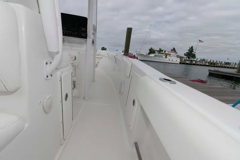 Slide: The Image of 2017 Sea Hunt Gamefish 27 Coffin Box boat docked at marina, interior view. - 11