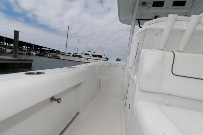 Slide: The Image of 2017 Sea Hunt Gamefish 27 Coffin Box boat interior, docked with marina view. - 12