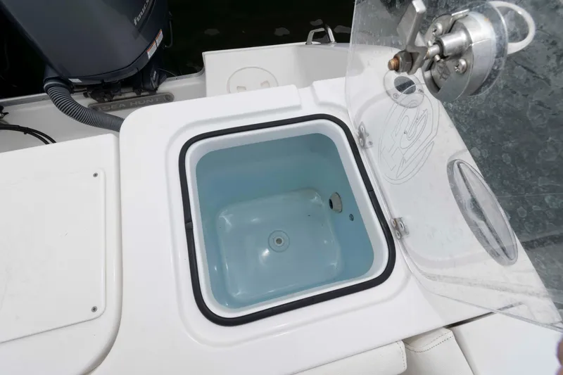 Slide: The Image of Open storage compartment on 2017 Sea Hunt Gamefish 27 Coffin Box boat. - 16