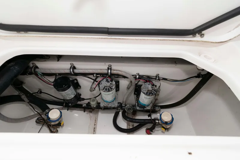 Slide: The Image of 2017 Sea Hunt Gamefish 27 Coffin Box interior wiring and plumbing components. - 19