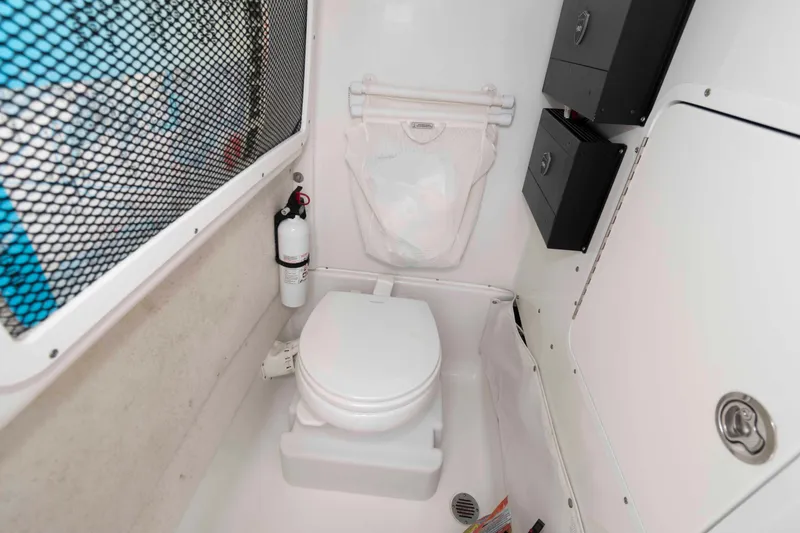 Slide: The Image of Interior of 2017 Sea Hunt Gamefish 27 Coffin Box boat with toilet and fire extinguisher. - 20