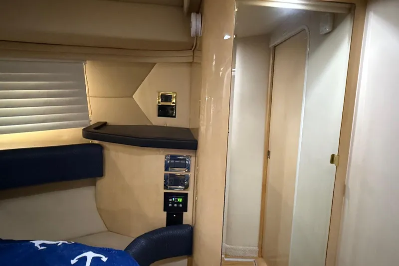 Slide: The Image of Interior cabin of 2000 Sea Ray 380 Sundancer yacht, featuring modern design and cozy amenities. - 15