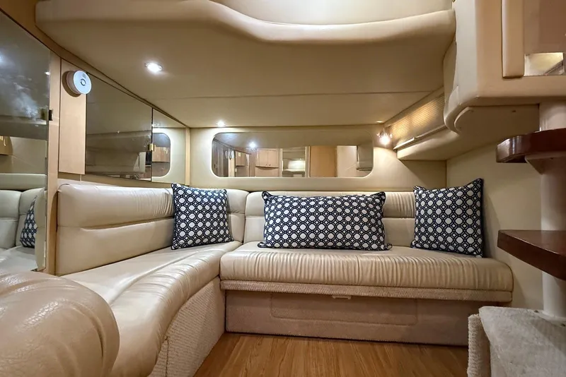 Slide: The Image of Luxurious interior of 2000 Sea Ray 380 Sundancer yacht with plush seating and decorative pillows. - 16