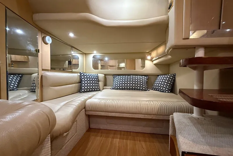 Slide: The Image of Luxurious interior of 2000 Sea Ray 380 Sundancer with plush seating and elegant decor. - 17