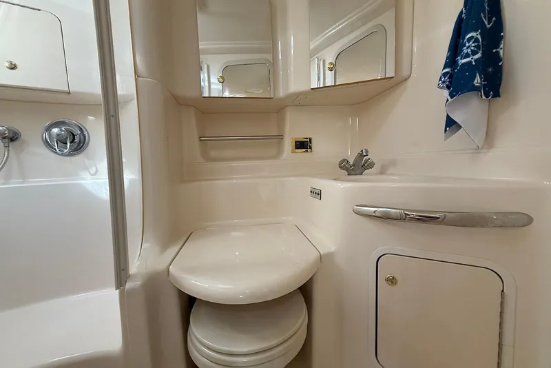 Slide: The Image of Bathroom interior of 2000 Sea Ray 380 Sundancer yacht, featuring compact design and fixtures. - 20