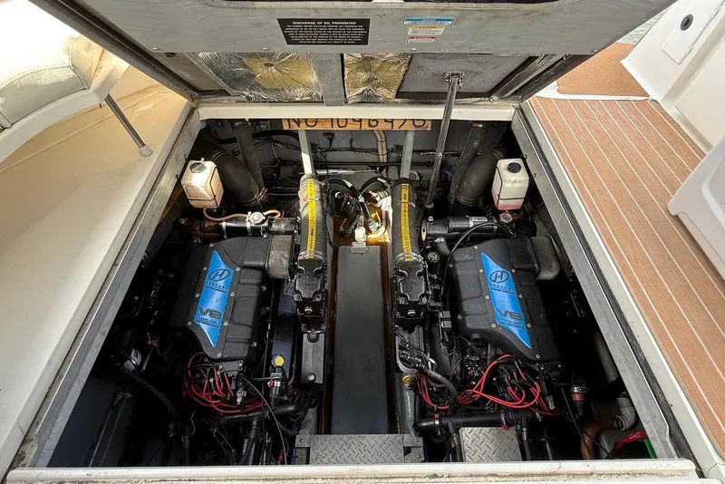 Slide: The Image of Engine compartment of a 2000 Sea Ray 380 Sundancer with twin V8 engines. - 24