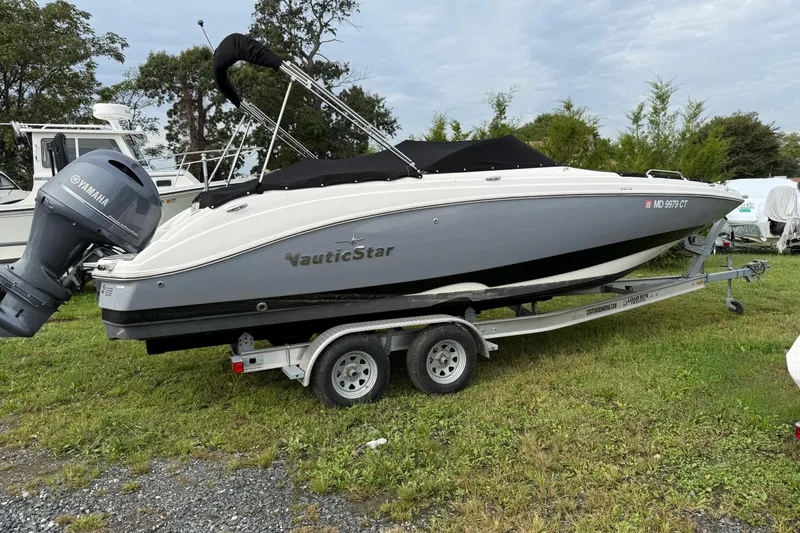 Slide: The Image of 2022 NauticStar 243 DC boat on trailer with Yamaha outboard motor. - 3