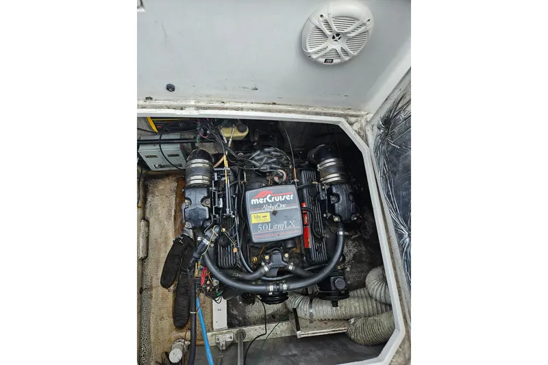 Slide: The Image of Engine compartment of a 1988 Trojan 8.6 Meter Mid-Cabin boat with MerCruiser 5.0L engine. - 14