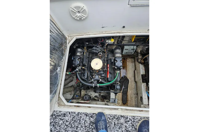 Slide: The Image of Engine compartment of a 1988 Trojan 8.6 Meter Mid-Cabin boat, showing detailed components. - 15