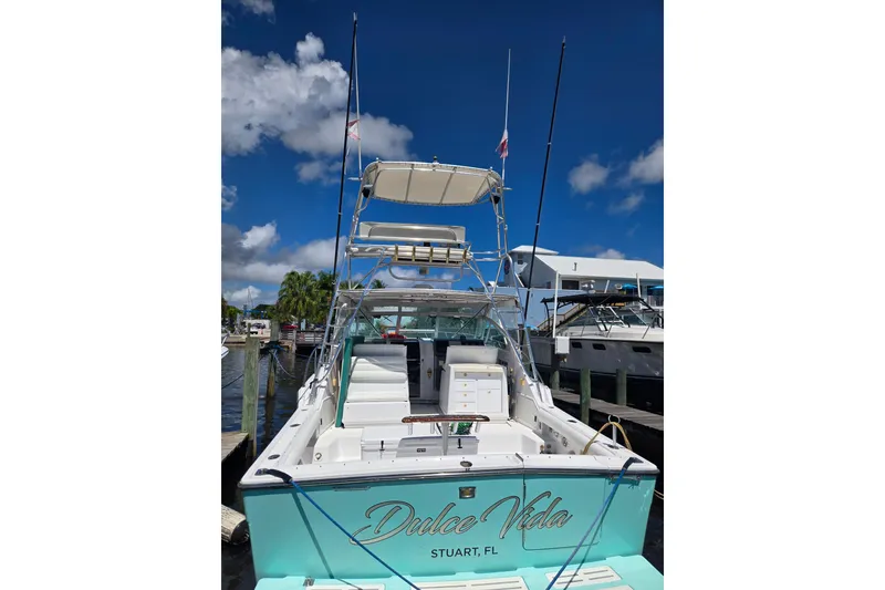 Slide: The Image of 1992 Tiara Yachts 3600 Open docked in Stuart, FL, under a clear blue sky. - 2