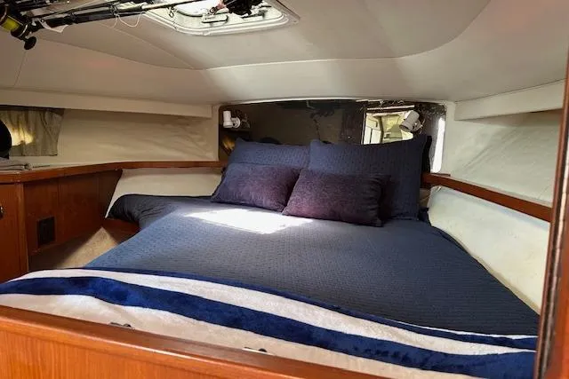 Slide: The Image of Cozy cabin interior of 1992 Tiara Yachts 3600 Open with comfortable bedding. - 21