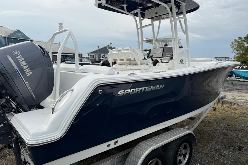 Slide: The Image of 2015 Sportsman Heritage 231 Center Console boat with Yamaha engine on trailer. - 2